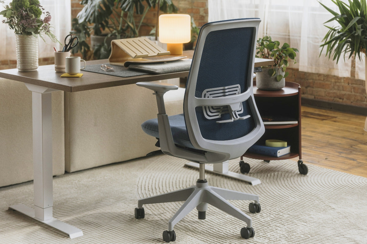Perk Height-Adjustable Desk in lifestyle shot